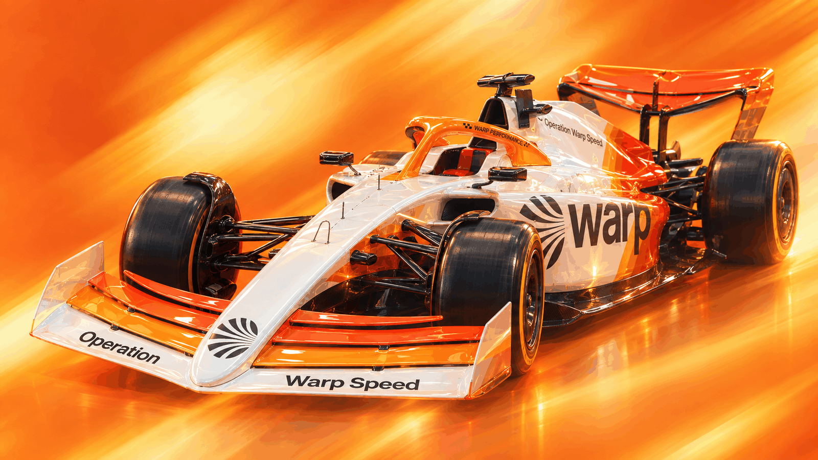 A Formula 1 car in Warp's white and orange livery, marked “Operation Warp Speed”